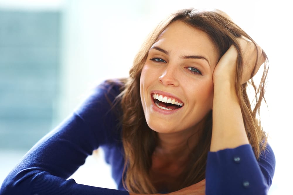 happy brunette woman laughing
