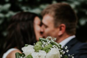 couple kissing at a wedding