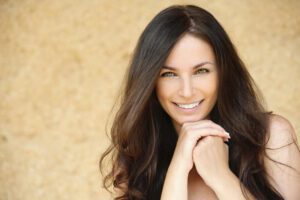 beautiful middle aged woman with long hair smiling