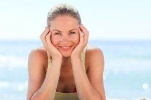 Lovely woman sunbathing at the beach