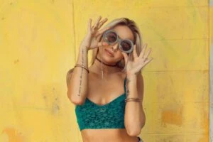 woman by yellow wall