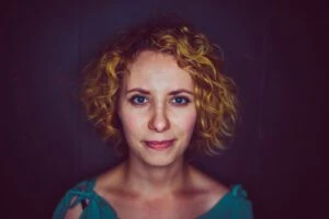 woman in turquoise shirt